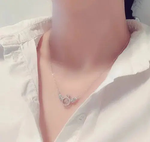 RadiantRise™ – Dainty Angel Wing Necklace with Floating Sparkle Stone