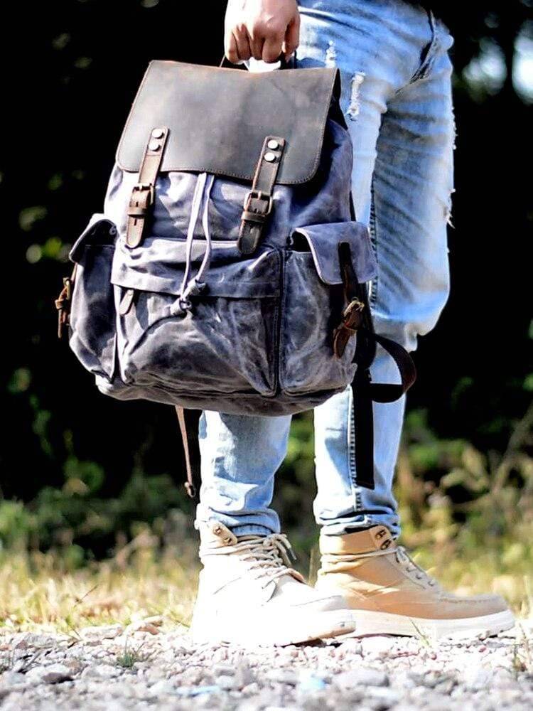 Spacious Backpack with Waterproof Canvas and Leather Design
