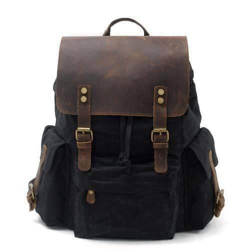 Spacious Backpack with Waterproof Canvas and Leather Design