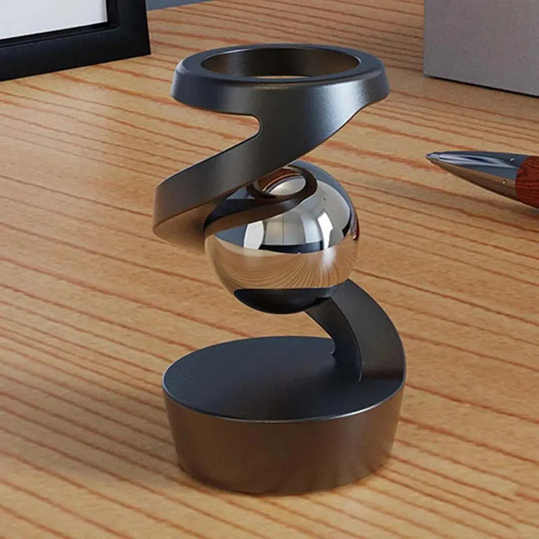 Kinetic Desk Gadget Featuring Floating Gravity