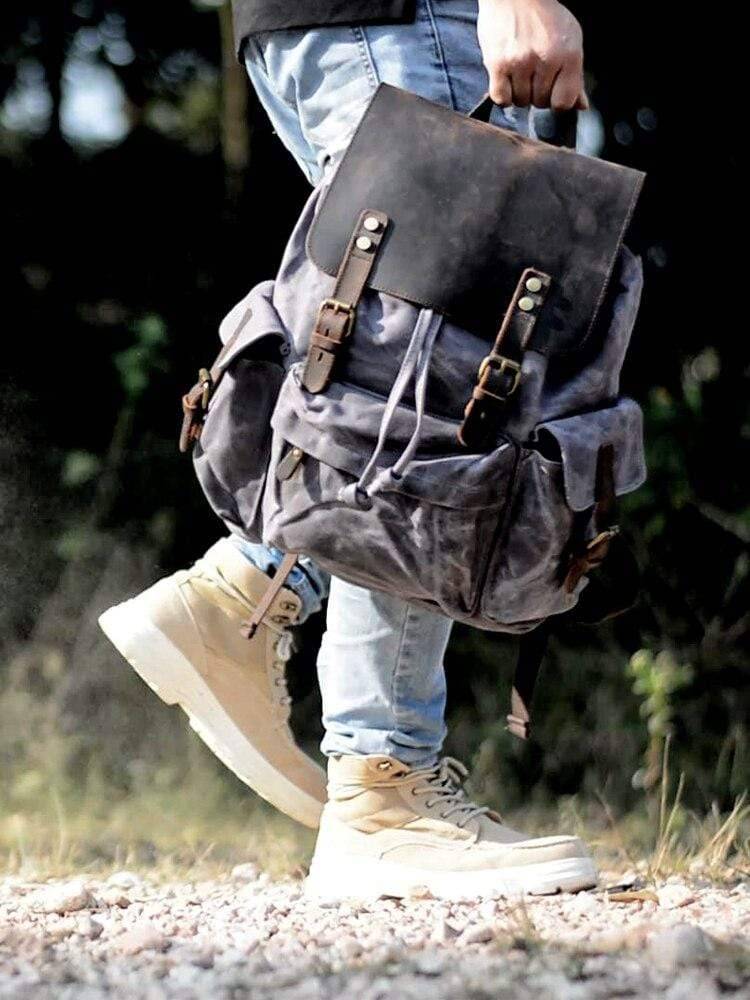 Spacious Backpack with Waterproof Canvas and Leather Design