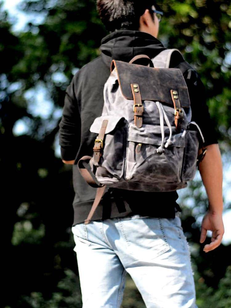 Spacious Backpack with Waterproof Canvas and Leather Design